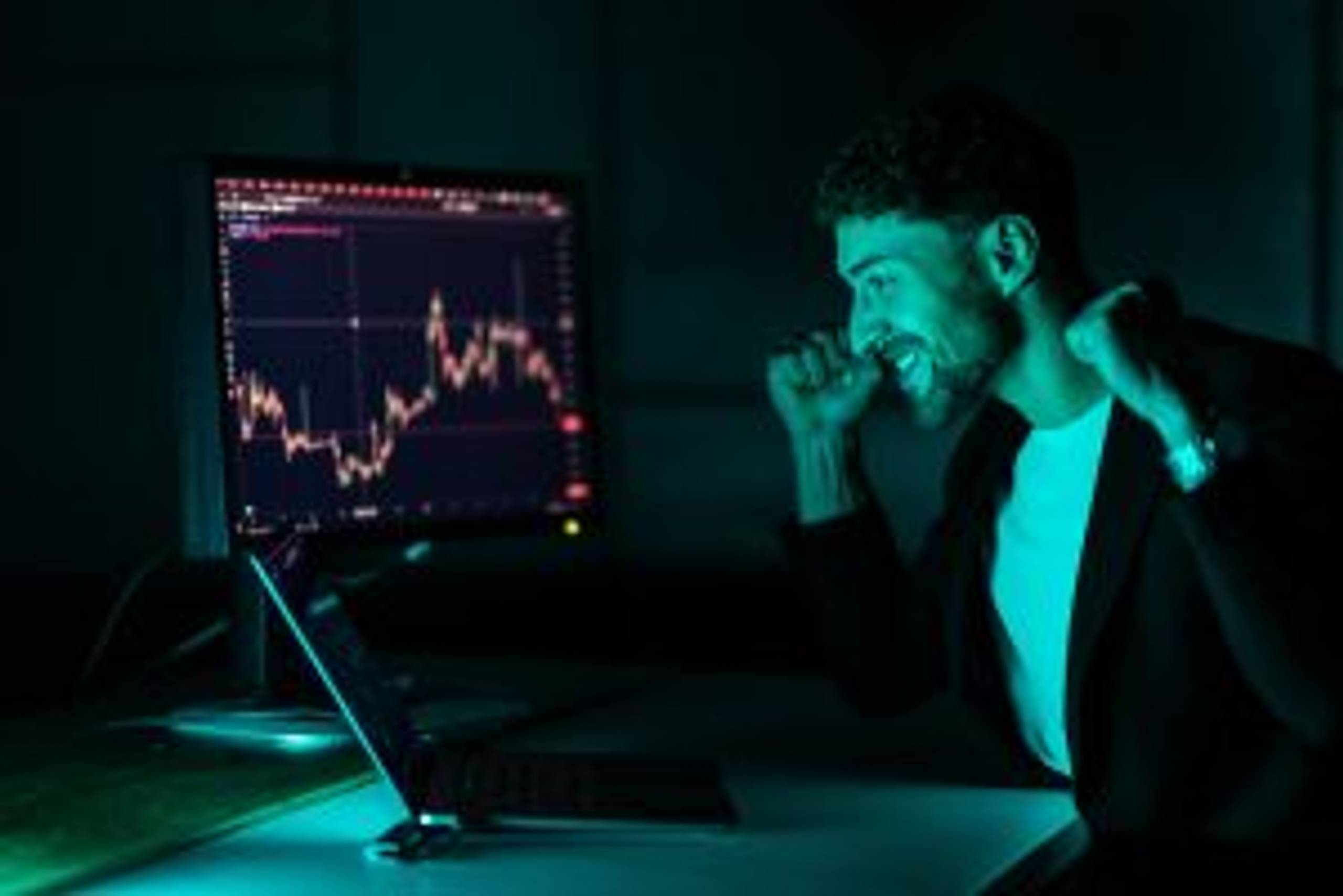 Cheerful broker celebrating exchange market achievement, feeling happy about financial win and forex trade victory.